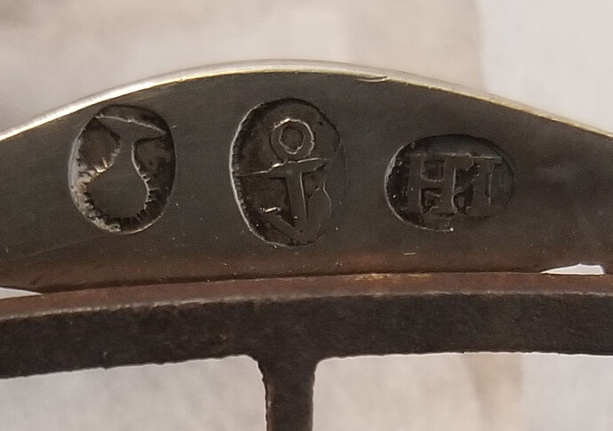 silver marks on buckle